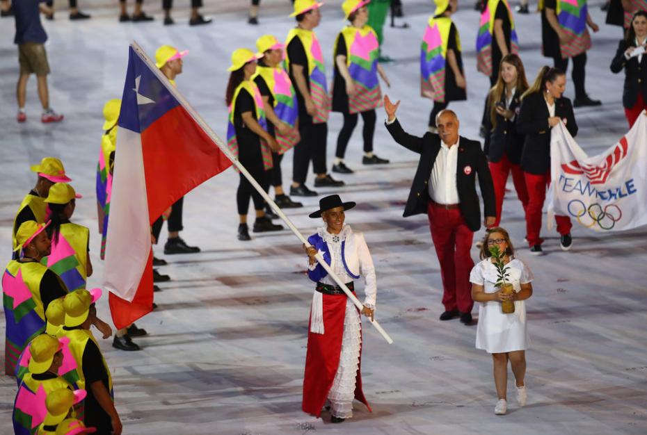 RIO DE JANEIRO, BRAZIL - AUGUST 05:  Erika Olivera of Chile carries the flag during the Opening Ceremony of the Rio 2016 Olympic Games at Maracana Stadium on August 5, 2016 in Rio de Janeiro, Brazil.  (Photo by Clive Brunskill/Getty Images)