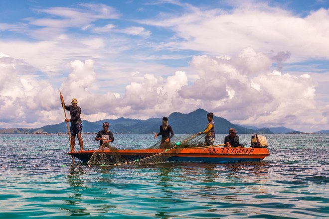 Pic by Claudio Sieber/Caters News - (Pictured: Sea Bajau who live within a basic setup on their handmade houseboats (called lepa lepa) 01/06/2017.) - THESE fascinating images reveal what life is like for the Bajau people - a nomadic tribe who spend their lives on the water. The group have been dubbed sea gypsies thanks to the fact they continue to live a seaborne lifestyle.The striking images - taken by photographer Claudio Sieber - show youngsters out catching fish in long narrow canoes. He took the pictures off the coast of Borneo where the Bajau are able to dive up to 20 metres without the use of modern scuba gear.They even reportedly experience land sickness when they leave the water. SEE CATERS COPY.