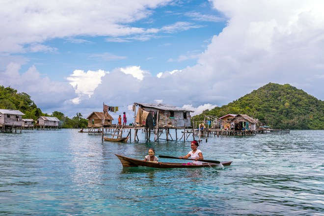 Pic by Claudio Sieber/Caters News - (Pictured:Bajau stilt house village close to Pulau Bodgaya. 30/05/2017.) - THESE fascinating images reveal what life is like for the Bajau people - a nomadic tribe who spend their lives on the water. The group have been dubbed sea gypsies thanks to the fact they continue to live a seaborne lifestyle.The striking images - taken by photographer Claudio Sieber - show youngsters out catching fish in long narrow canoes. He took the pictures off the coast of Borneo where the Bajau are able to dive up to 20 metres without the use of modern scuba gear.They even reportedly experience land sickness when they leave the water. SEE CATERS COPY.