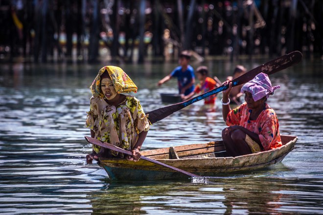 Pic by Claudio Sieber/Caters News - (Pictured: Sea Bajau who live within a basic setup on their handmade houseboats (called lepa lepa) 25/05/2017.) - THESE fascinating images reveal what life is like for the Bajau people - a nomadic tribe who spend their lives on the water. The group have been dubbed sea gypsies thanks to the fact they continue to live a seaborne lifestyle.The striking images - taken by photographer Claudio Sieber - show youngsters out catching fish in long narrow canoes. He took the pictures off the coast of Borneo where the Bajau are able to dive up to 20 metres without the use of modern scuba gear.They even reportedly experience land sickness when they leave the water. SEE CATERS COPY.