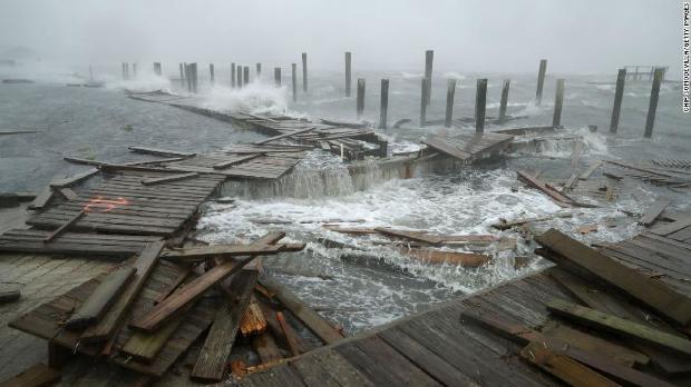 Waves crash around the Oceana Pier as the outer edges of Hurricane Florence being to affect the coast September 13, 2018 in Atlantic Beach, United States. Coastal cities in North Carolina, South Carolina and Virgnia are under evacuation orders as the Category 2 hurricane approaches the United States.