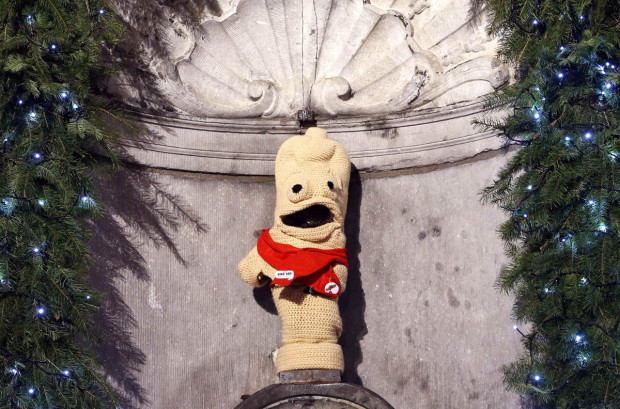 The famous Belgian statue Manneken Pis is dressed as a condom during an event marking World AIDS Day in central Brussels