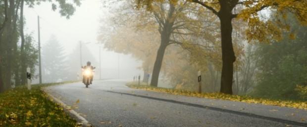 Motorcycle-rides-on-foggy-road-horizontal-crop-resize-625×260