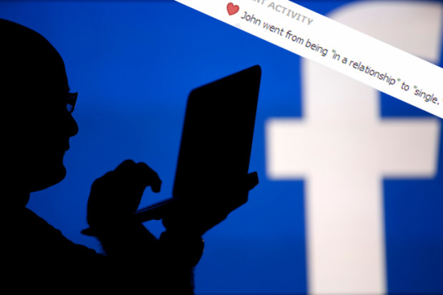 A man is silhouetted against a video screen with an Facebook logo as he poses with an Dell laptop in this photo illustration taken in the central Bosnian town of Zenica