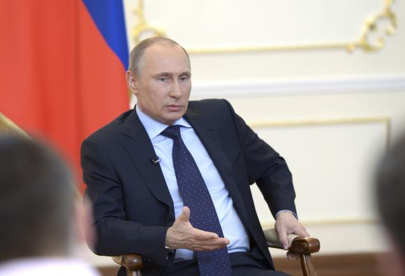 Russian President Putin takes part in a news conference at the Novo-Ogaryovo state residence outside Moscow