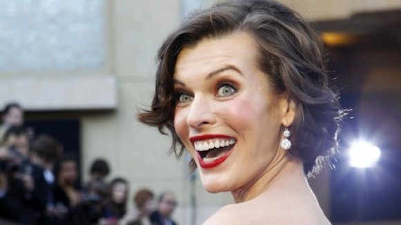 Actress-Milla-Jovovich-smiles-as-she-arrives-at-the-84th-Academy-Awards-in-Hollywood