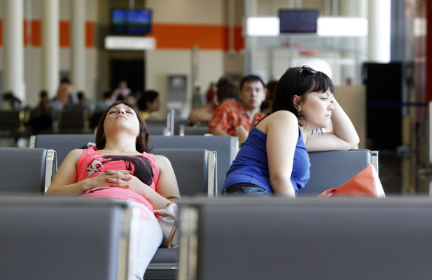 People sit in a waiting room at Moscow’s Sheremetyevo airport