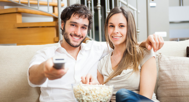 young-couple-preparing-to-watch-2