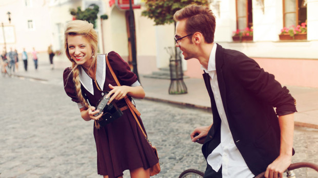 Young-funny-pretty-fashion-vintage-hipster-couple-having-fun-outdoor-on-the-street-in-summer