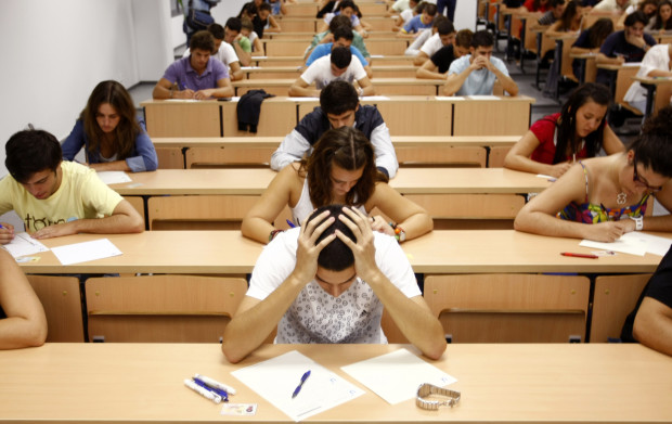 Students take a university entrance examination at a lecture hall in the Andalusian capital of Seville