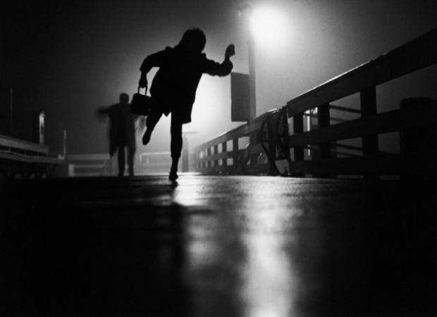 10180845-woman-with-purse-running-from-at-night-gettyimages