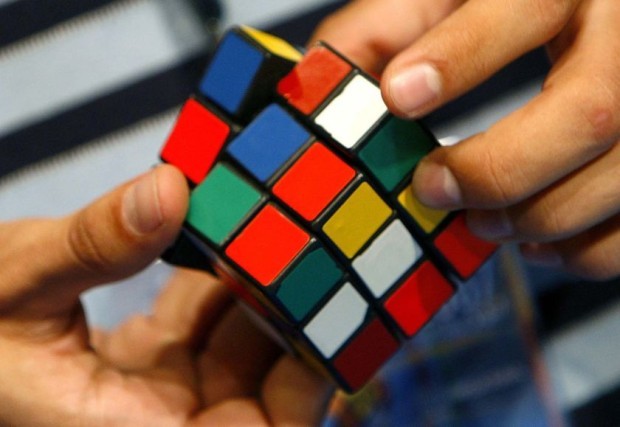 playing_rubiks_cube-13768