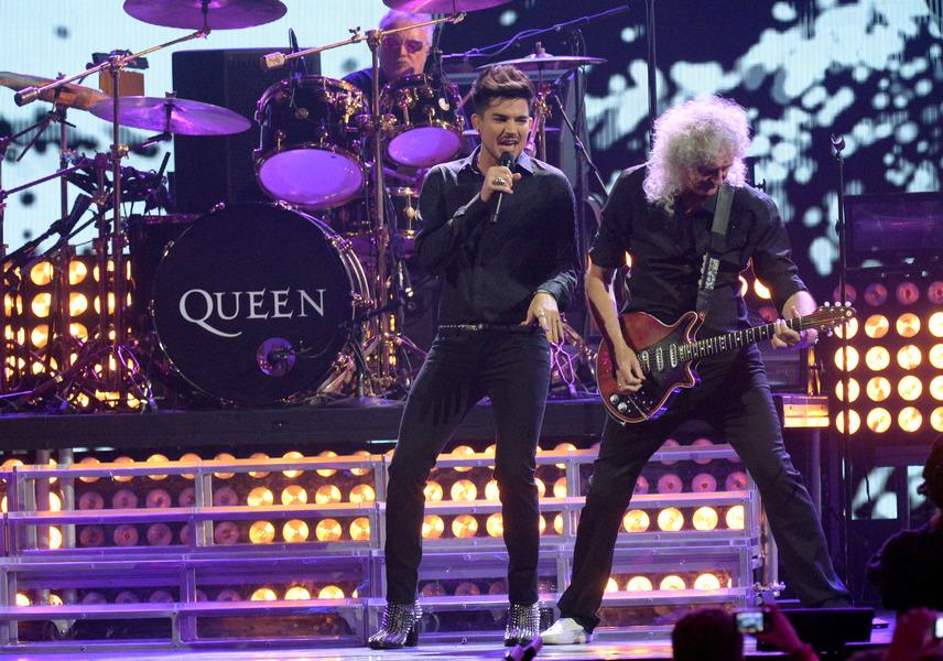 LAS VEGAS, NV - SEPTEMBER 20: Adam Lambert, Roger Taylor and Brian May of Queen performs on day 1 of the iHeartRadio Music Festival at MGM Garden Arena on September 20, 2013 in Las Vegas, Nevada. (Photo by Jeff Kravitz/FilmMagic)