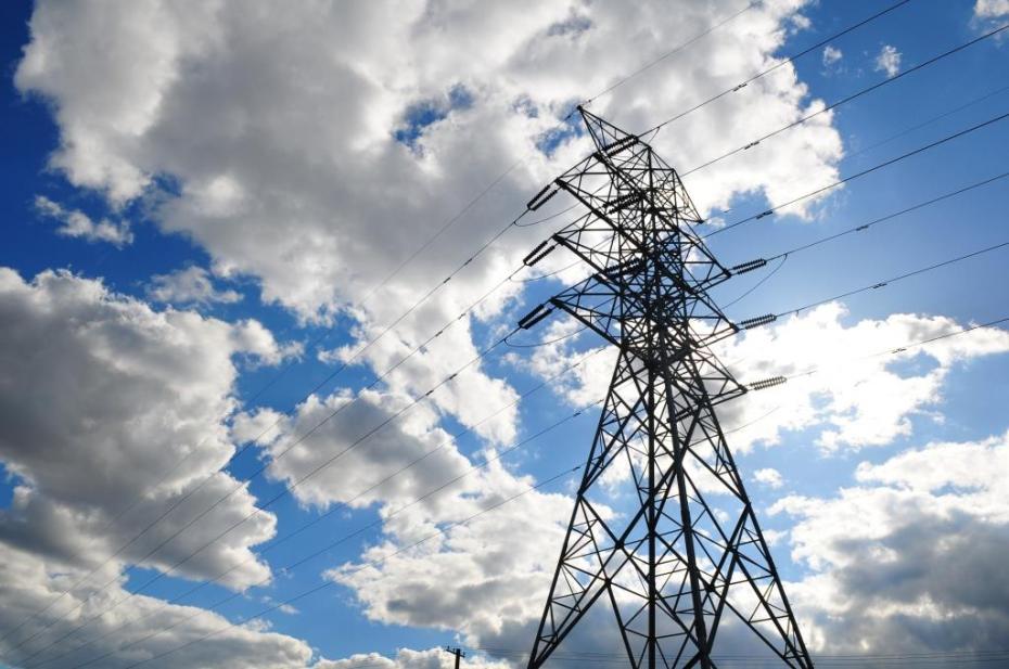 electrcity-pilon-in-a-dramatic-blue-cloudy-sky-croped