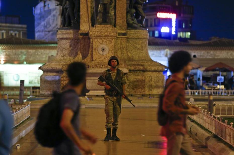 A Turkish military stands guard in the Taksim Square in Istanbul