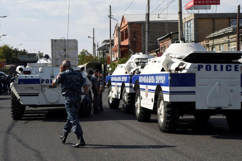 Policemen block a street after group of armed men seized a police station along with an unknown number of hostages,  according the country’s security service, in Yerevan, Armenia