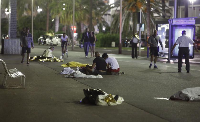 Bodies are seen on the ground after at least 30 people were killed in the southern French town of Nice when a truck ran into a crowd celebrating the Bastille Day national holiday