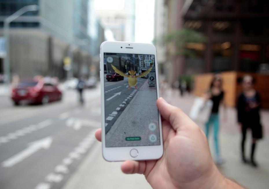 Photo illustration of a „Pidgey” Pokemon seen on the screen of the Pokemon Go mobile app