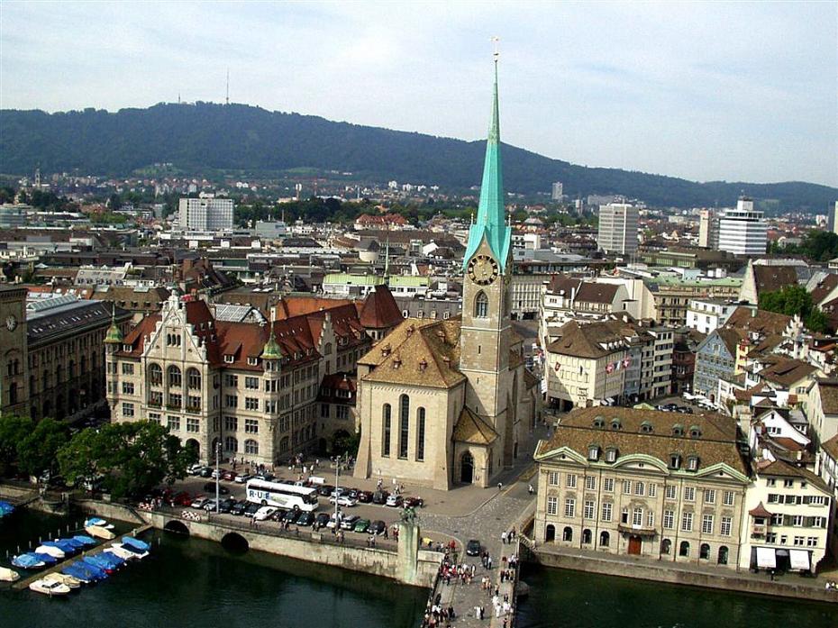 zrh-st-peters-church-twoer-clock-face-limmat-river-switzerland-zurich-city-center-boats-view-from-above