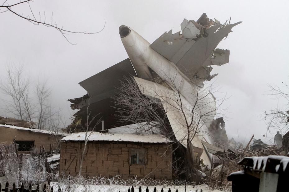 Plane debris is seen at the crash site of a Turkish cargo jet near Kyrgyzstan’s Manas airport outside Bishkek