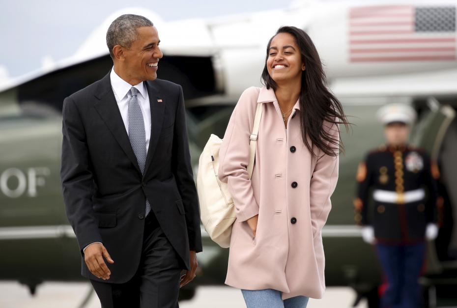 U.S. President Barack Obama and his daughter Malia walk from Marine One to board Air Force One upon their departure from O’Hare Airport in Chicago