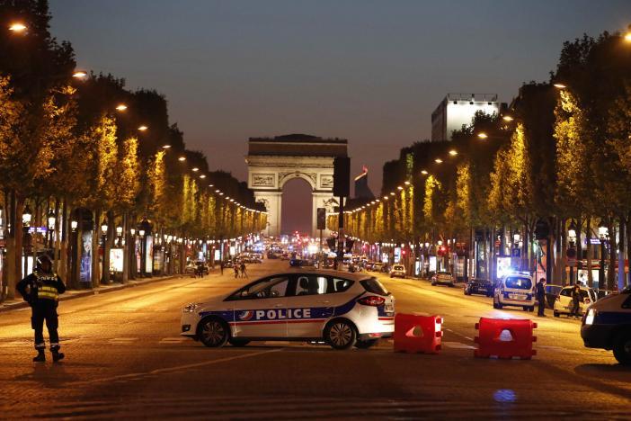 Police secure the Champs Elysee Avenue after one policeman was killed and another wounded in a shooting incident in Paris