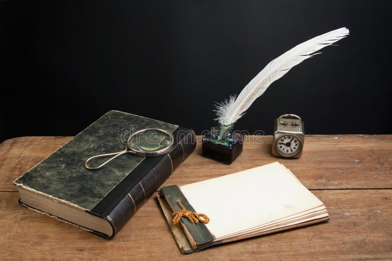 old-notepad-book-quill-magnifying-glass-24180145