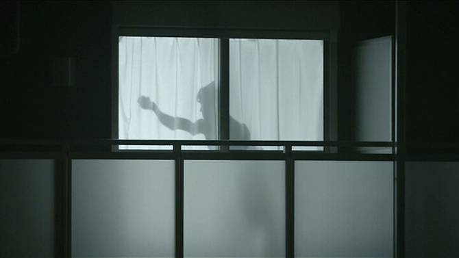 man-on-curtain-projected-shadow-in-japan