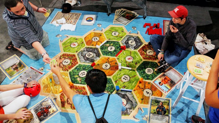 Attendees play the Catan board game at the Gaming Expo at the South by Southwest Music Film Interactive Festival 2017 in Austin