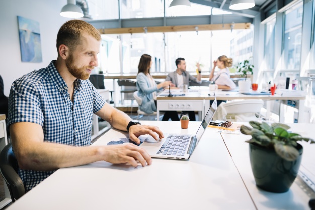 thoughtful-man-at-laptop-in-office_23-2147669301