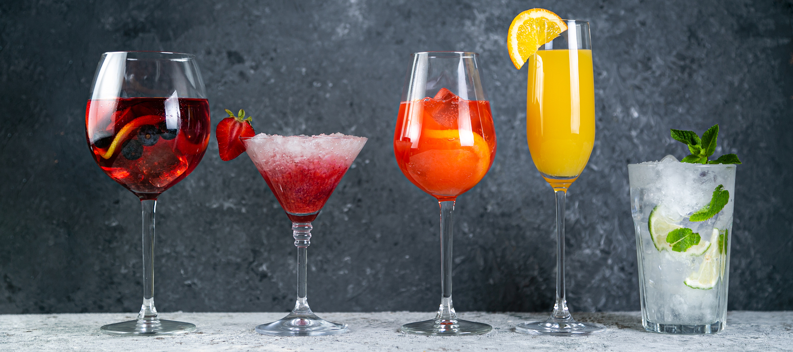 Selection of refreshing summer drinks - mojito, sangria, mimosa, aperol, martini, rustic background copy space