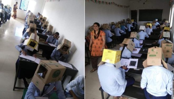 Mai mulți elevi de la un colegiu din India au fost surprinși cum purtau cutii de carton pe cap în timpul unui examen