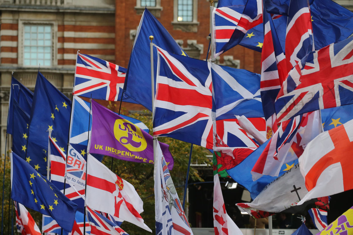 EU and Union flags fly outside the Houses of Parliament in central London on October 29, 2019. - Britain was on course for a December election today after the main opposition Labour party said it would support Prime Minister Boris Johnson's plan, although a date has not yet been fixed. (Photo by ISABEL INFANTES / AFP) (Photo by ISABEL INFANTES/AFP via Getty Images)