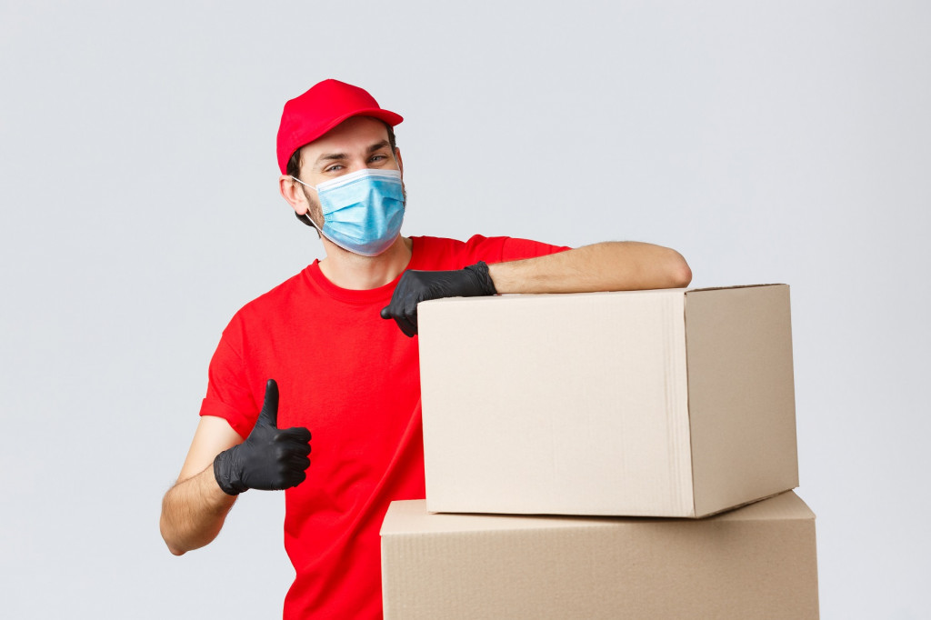 packages-parcels-delivery-covid-19-quarantine-transfer-orders-confident-courier-red-uniform-gloves-medical-mask-encourage-call-service-show-thumb-up-lean-boxes