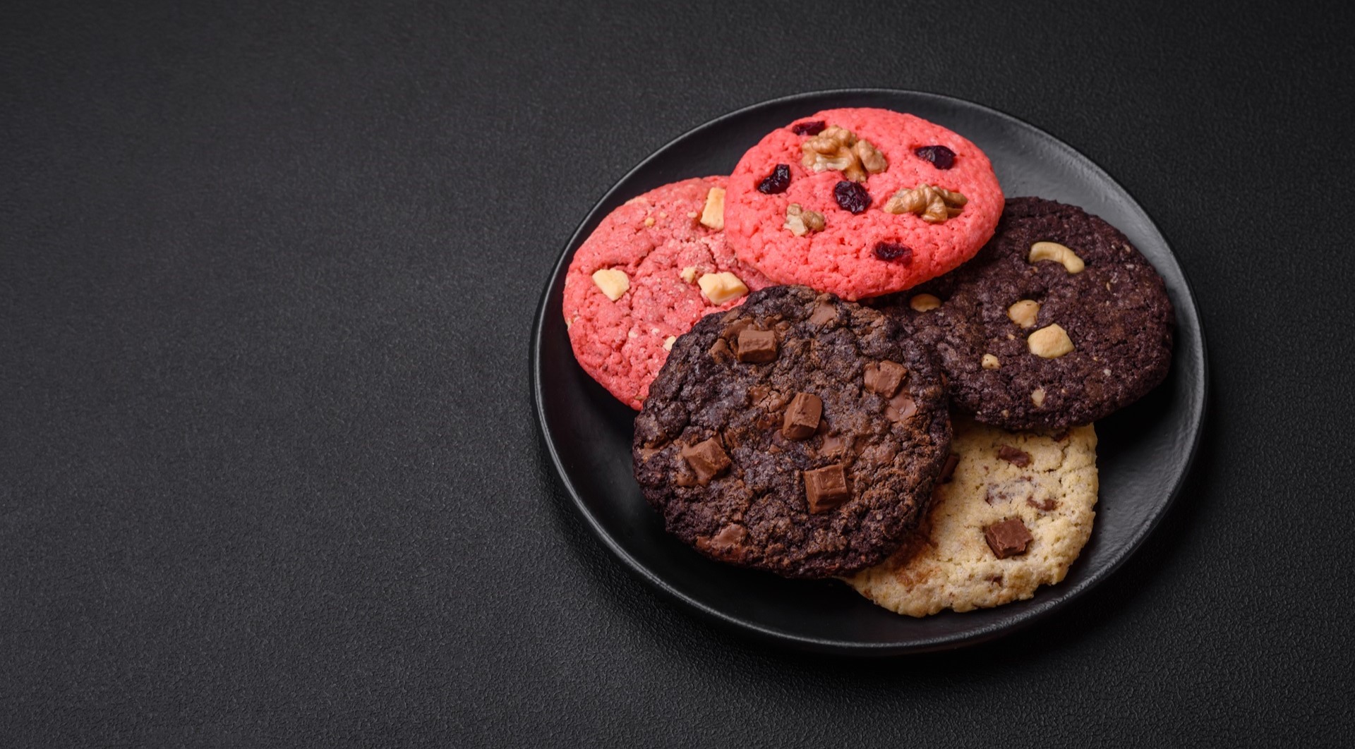 Delicious fresh crispy oatmeal cookies with chocolate and nuts