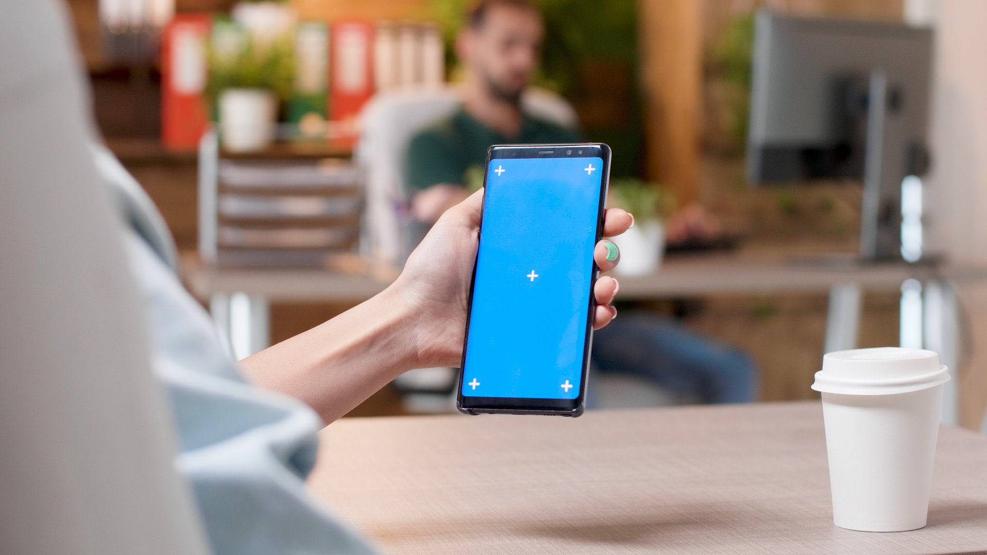 businesswoman-looking-at-mock-up-green-screen-chro-2025-02-19-23-12-14-utc